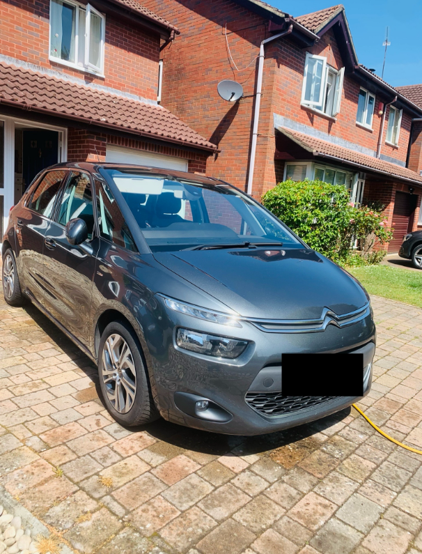 Clean red car exterior after detailing